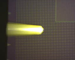 An alternate configuration where in addition to its function as cantilever/sample monitor, a fiber-coupled laser can be collimated and focused onto the tip/sample region.